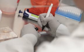 Dr. Rhonda Flores labels protein samples at Novavax labs in Gaithersburg, Maryland, United States, on March 20, 2020, one of the labs developing a vaccine for Covid-19.