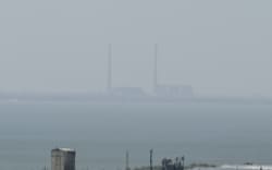 Concerns are increasing over attacks in and around the Zaporizhzhia nuclear power plant, seen here across the Dnipro river.