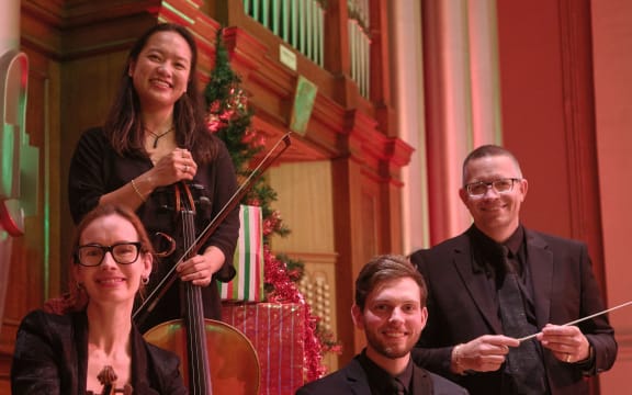 Auckland Philharmonia musicians with Christmas Cheer conductor David Kay.