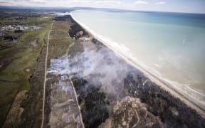Canterbury fire crews have been battling a large scrub fire at Woodend beach. Helicopters and Planes got brought in to help fight the fire. 03 November 2022 New Zealand Herald Photograph by George Heard