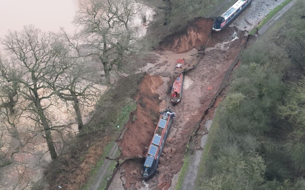 A sinkhole is seen in Whitchurch, England, in this image provided by Shropshire Fire and Rescue Service.