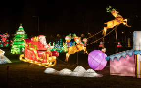 A christmas inspired light sculpture is displayed during a chinese-themed light sculpture festival in Tallinn