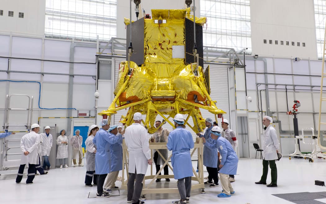 (FILES) This handout photograph taken and released by Russian Space Agency Roscosmos on July 13, 2023, shows the Luna-25 rover (Moon-25) installed by technicians at the Vostochny cosmodrome, some 180 km north of Blagoveschensk, in the Amur region. Moscow's Luna-25 lunar lander is due to reach the orbit of the Moon August 16, 2023, in the first such Russian mission in almost 50 years, according to the schedule of space agency Roscosmos. (Photo by Handout / Russian Space Agency Roscosmos / AFP) / RESTRICTED TO EDITORIAL USE - MANDATORY CREDIT "AFP PHOTO / HO/Russian Space Agency Roscosmos " - NO MARKETING NO ADVERTISING CAMPAIGNS - DISTRIBUTED AS A SERVICE TO CLIENTS