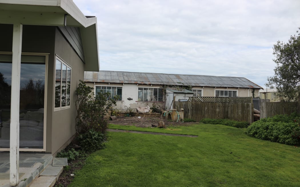 Glen and Megan Lindsay wanted to extend their house out into the grassy area, but were told they would have to raise their floor level and the roof along with it.