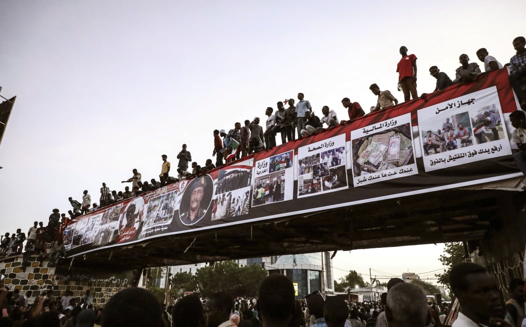 Sudanese protesters chant slogans during a rally outside the army headquarters in Sudan's capital Khartoum on Saturday, April 20, 2019.