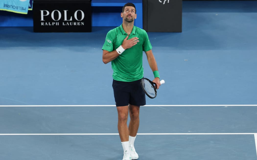 Serbia's Novak Djokovic celebrates after victory against Spain’s Pedro Martinez during their men's singles match on day two of the Australian Open tennis tournament in Melbourne on January 19, 2026. (Photo by IZHAR KHAN / AFP) / -- IMAGE RESTRICTED TO EDITORIAL USE - STRICTLY NO COMMERCIAL USE --