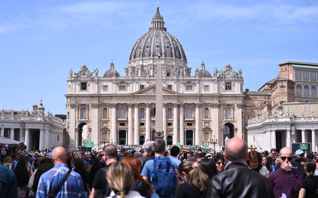 Pilgrims gather for the death of Pope Francis at St. Peter's Basilica in Vatican City, State of Vatican, on April 21, 2025. The Vatican announces that Pope Francis, 88, dies ''this morning at 07:35 local time (05:35 GMT) as the Bishop of Rome, Francis, returns to the home of the Father.'' (Photo by Domenico Cippitelli/NurPhoto) (Photo by Domenico Cippitelli / NurPhoto / NurPhoto via AFP)