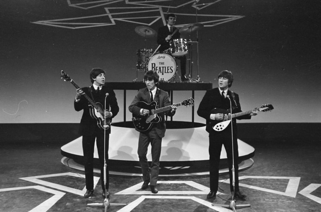 The Beatles performing in 1964