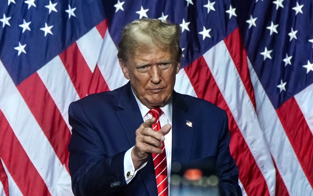 Former US President and 2024 presidential hopeful Donald Trump gestures to the crowd  after speaking at a campaign event in Rome, Georgia, on March 9, 2024. (Photo by Elijah Nouvelage / AFP)