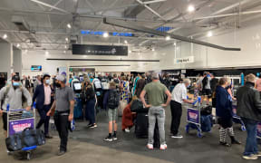 People checking in at Auckland Airport's domestic terminal.