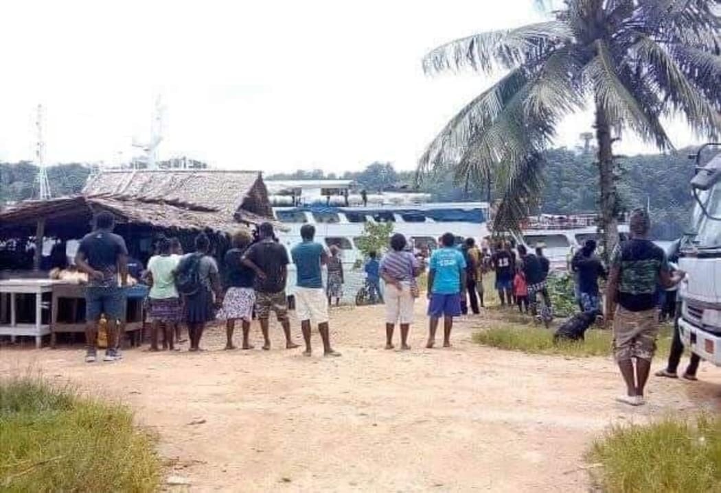 Solomon Islanders observe the MV Taimareho