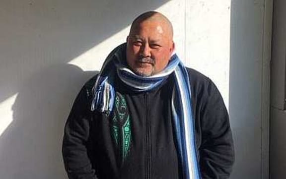 Maori man with scarf around neck