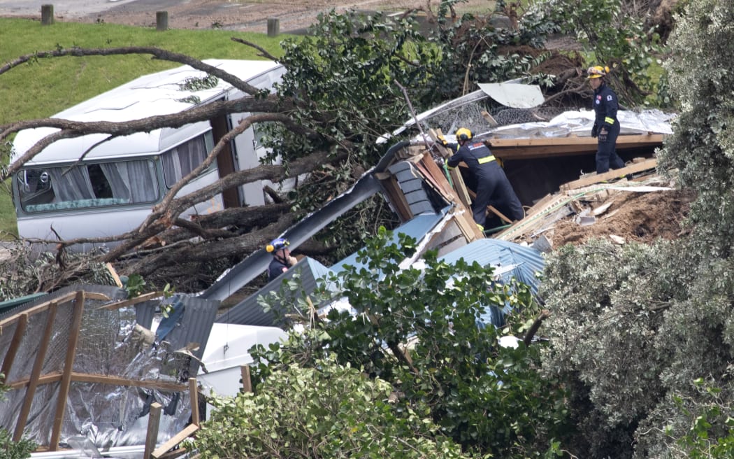 Officials work at the scene of todays landslide at the Beachside Holiday Park in Mt Maunganui.22 January 2026 Photograph by Alan Gibson.