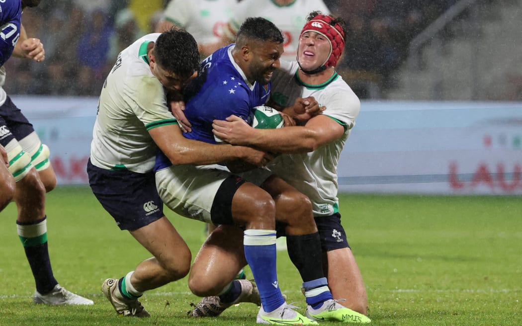 Lima Sopoaga is tackled during the pre-World Cup rugby test match between Ireland and Samoa in Bayonne.
