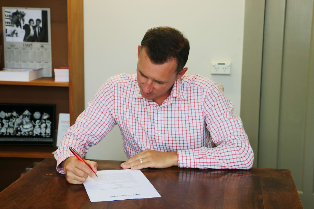 Labour list MP Jamie Strange examines his member's bill in his Hamilton office.