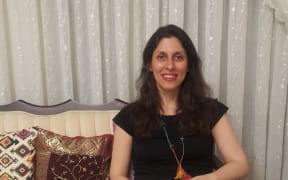 A handout picture released by the Free Nazanin campaign on March 17, 2020 shows Nazanin Zaghari-Ratcliffe wearing an ankle tag as she poses for a photograph in West Tehran, Iran following her release from prison for two weeks.
