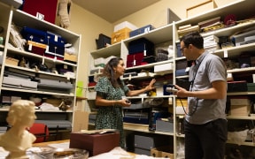 Parliamentary Curator Tasha Fernandez shows Johnny Blades  Parliament's collection of taonga, stored in the vault.