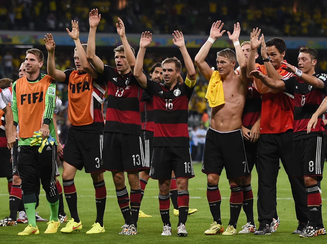 German teammates celebrate after the match.