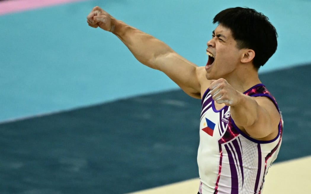 Philippines' Carlos Edriel Yulo reacts after competing in the artistic gymnastics men's floor exercise final during the Paris 2024 Olympic Games at the Bercy Arena in Paris, on August 3, 2024. (Photo by Loic VENANCE / AFP)