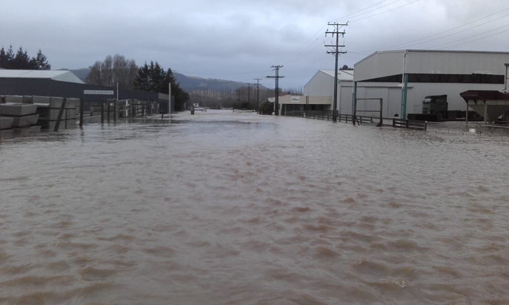 Flooding on the Lamberts' street during one of the floods.