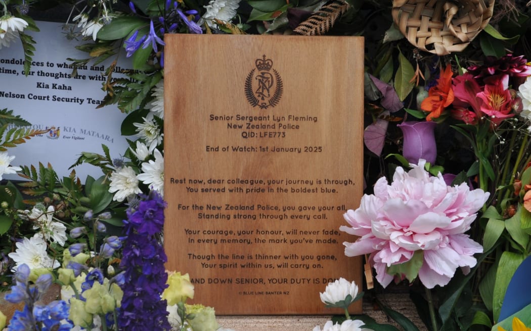 Police officers gather for a minute's silence to remember their colleague Senior Sergeant Lyn Fleming, who died after being struck by a vehicle while patrolling in central Nelson in the early hours of New Years Day.