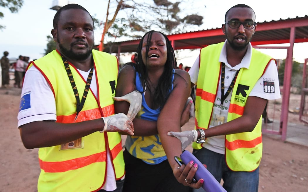 Paramedics help a student injured during the attack by al-Shabaab extremists.