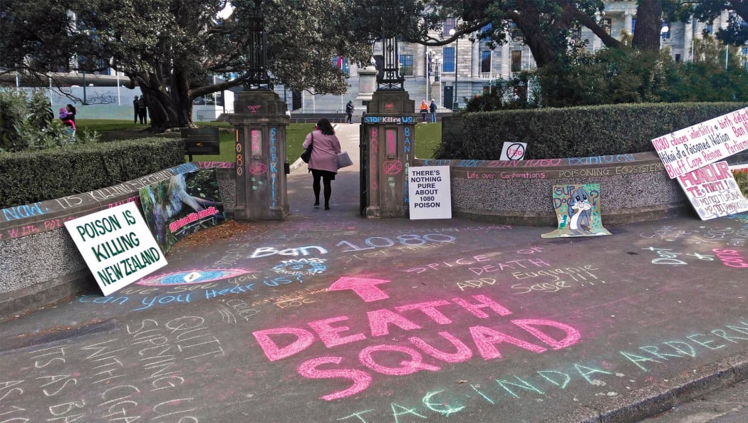 Extreme slogans chalked outsidethe entrance to Parliament during a recent against the use of 1080.