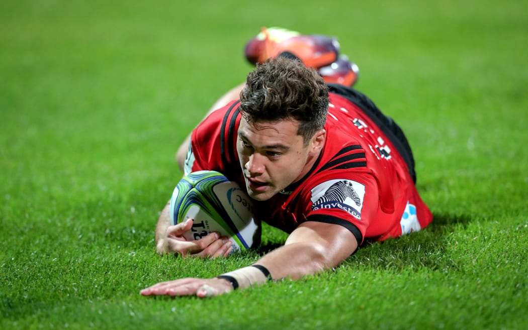 David Havili of the Crusaders dives over to score.