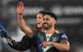 Shaun Johnson and wife Kayla wave to the crowd at Go Media Mt Smart Stadium.