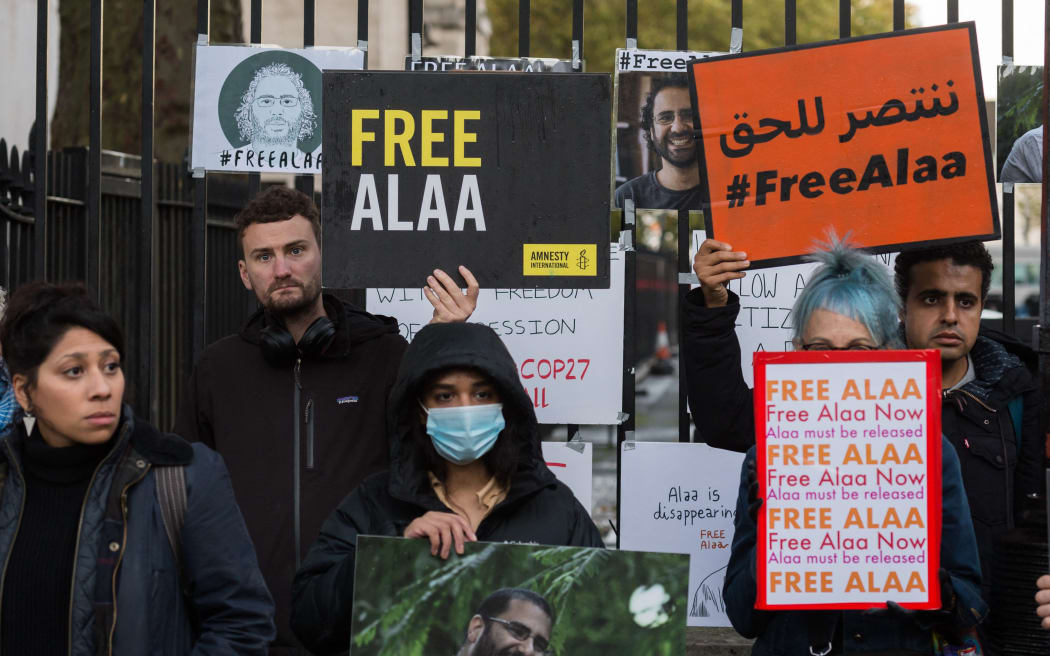 Demonstrators call on the British Prime Minister Rishi Sunak to raise the plight of Abd el-Fattah with the Egyptian authorities and help secure his release from prison after he was unfairly convicted late last year on spurious charges of spreading false news in social media posts.