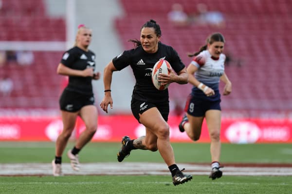 New Zealand’s Portia Woodman-Wickliffe races away from the Great Britain defence for a try on day one of the Madrid Sevens.