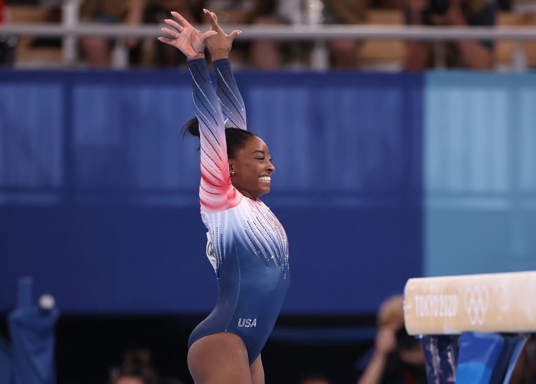 Simone Biles of United States reacts after performing artistic gymnastics womens balance beam final at Ariake Gymnastics Center in Koto Ward, Tokyo 3 August.