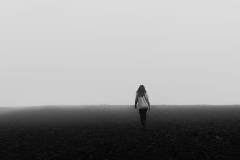 A woman walks alone.