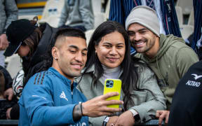 Rieko Ioane takes a selfie with Christchurch fans