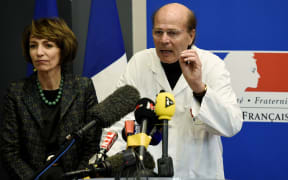 French Social Affairs and Health minister Marisol Touraine (L) and professor Gilles Edan (R)