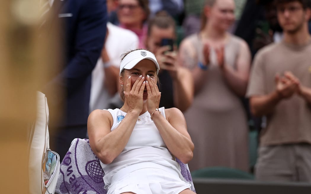 Kazakhstan's Yulia Putintseva celebrates winning against Poland's Iga Swiatek during their women's singles tennis match on the sixth day of the 2024 Wimbledon Championships at The All England Lawn Tennis and Croquet Club in Wimbledon, southwest London, on July 6, 2024. Putintseva won the third round match 3-6, 6-1, 6-2. (Photo by HENRY NICHOLLS / AFP) / RESTRICTED TO EDITORIAL USE