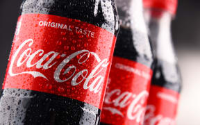 POZNAN, POLAND - MAR 1, 2018: Plastic bottles of Coca-Cola, a carbonated soft drink manufactured by The Coca-Cola Company headquartered in Atlanta, Georgia, USA