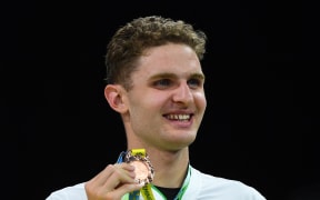 Bronze medalist New Zealand's Lewis Clareburt poses during the medal presentation ceremony for the men's 200m individual medley swimming final at the Sandwell Aquatics Centre, on day six of the Commonwealth Games in Birmingham.