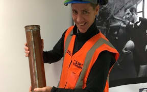 LT McGuiness surveyor Russell Mulder with the time capsule