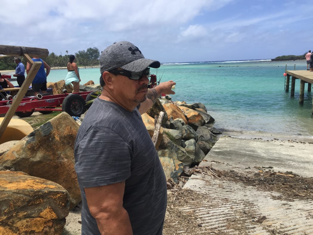 Cook Islands MP Tamaiva Tuavera points to where he rescued the three girls