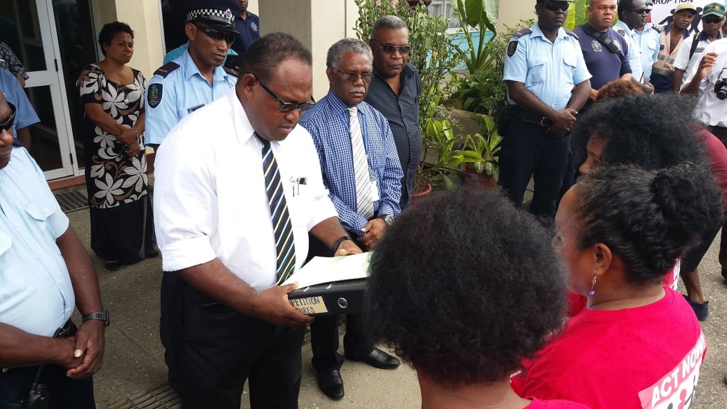 Solomon Islands' acting prime minister Manasseh Maelanga receives anti-corruption petition from civil society representatives. September 2017