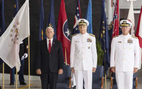 US Vice President Mike Pence, left, with Admiral Phil Davidson of the Indo Pacific Command and Rear Admiral Jon C Krietz.