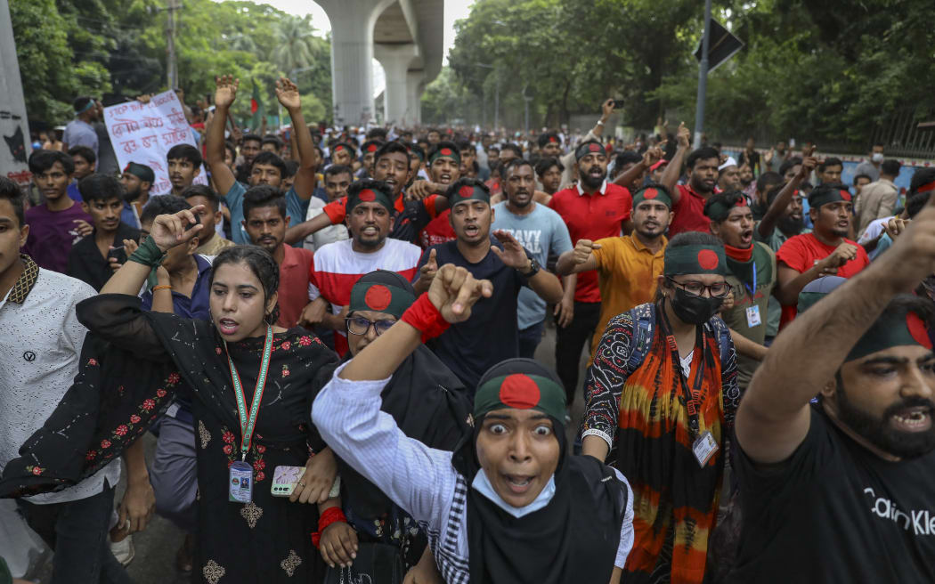 Protesters are blocking the Shahbagh intersection during a protest in Dhaka, Bangladesh, on August 4, 2024, to demand justice for the victims arrested and killed in the recent nationwide violence during anti-quota protests. The death toll from clashes on August 4 between Bangladeshi protesters demanding Prime Minister Sheikh Hasina resign and pro-government supporters is rising to at least 51, police and doctors are saying. (Photo by Ahmed Salahuddin/NurPhoto) (Photo by Ahmed Salahuddin / NurPhoto / NurPhoto via AFP)