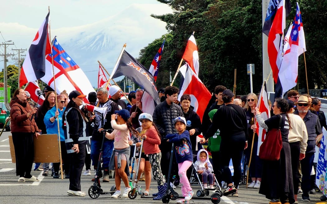 People marching through Patea in a hīkoi to oppose seabed mining, on 2 October, 2024.