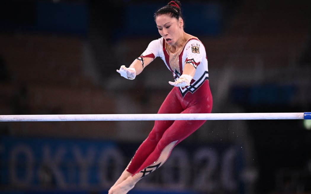 Germany's Kim Bui competes in the uneven bars event of the artistic gymnastics women's qualification during the Tokyo 2020 Olympic Games at the Ariake Gymnastics Centre in Tokyo on July 25, 2021