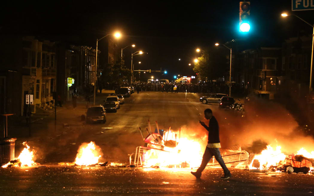 Fires burn during protests in Baltimore.