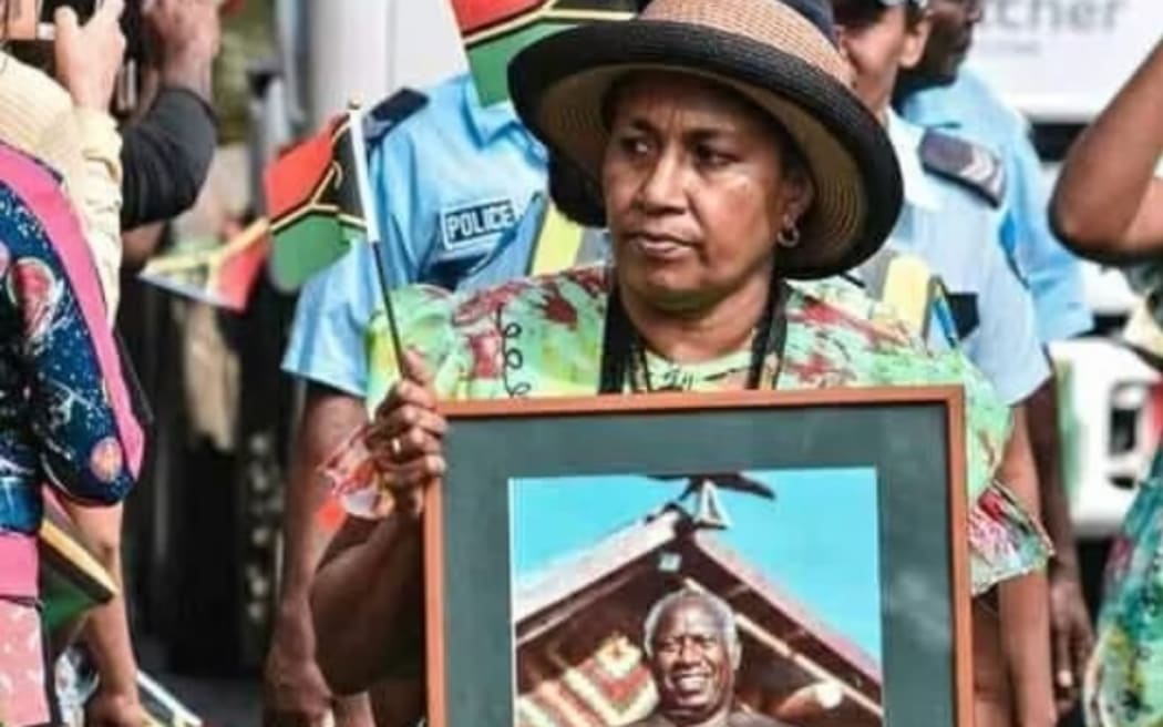 Lilon Bongmatur with a photo of her father, Willie, a name brought back from the cane fields of Queensland.