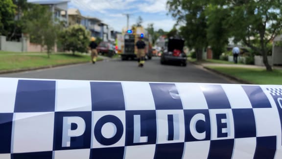 The police cordon at the scene where the car was set on fire in Brisbane.