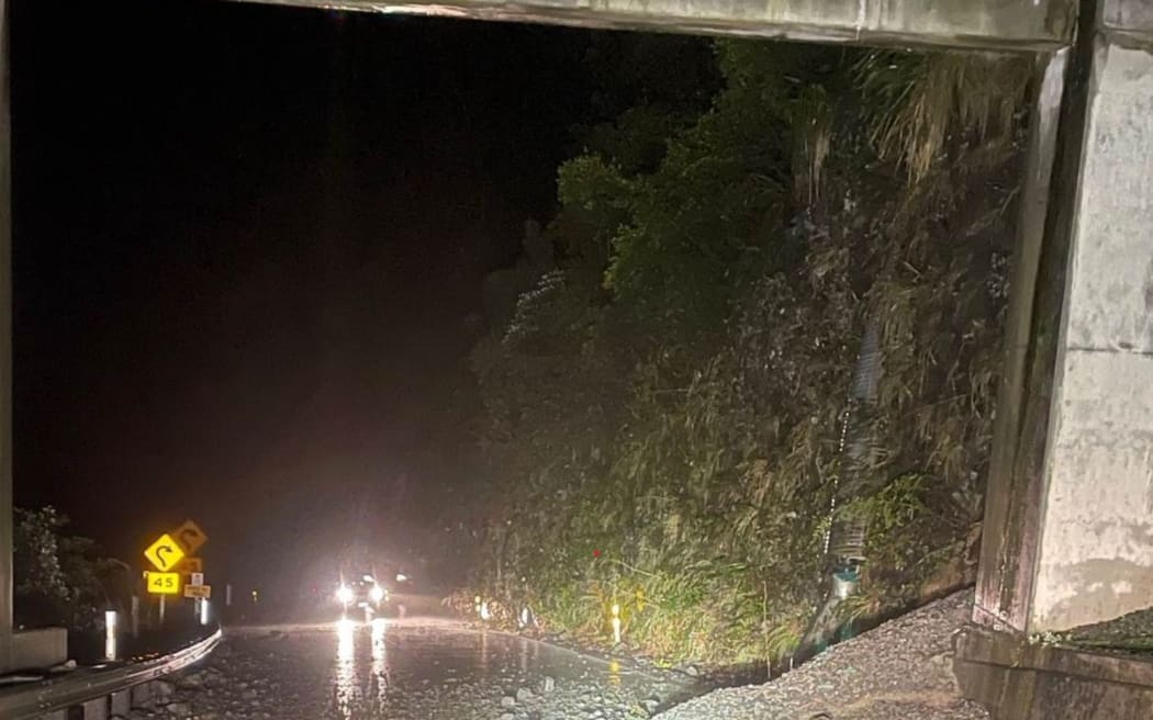 Rocks and debris on the road at the western side of the Rock Shelter, near the Otira Viaduct.