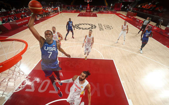 USA's Kevin Wayne Durant (L) goes to the basket in the men's quarter-final basketball match between Spain and USA during the Tokyo 2020 Olympic Games at the Saitama Super Arena in Saitama on August 3, 2021.